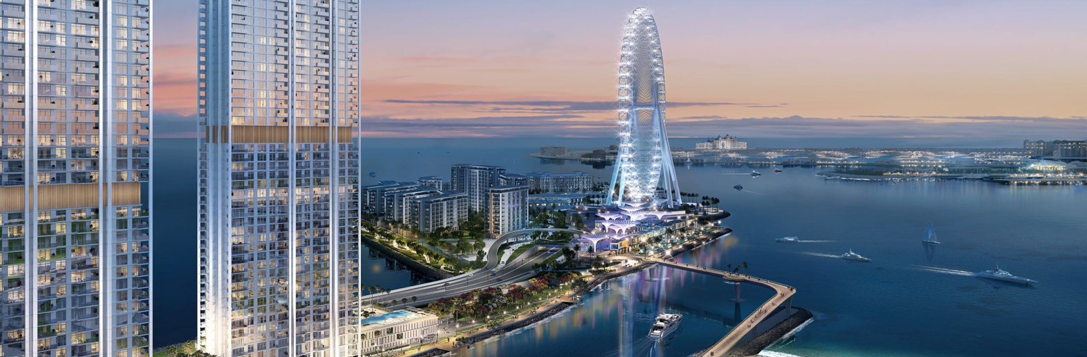 A vibrant view of Bluewaters Bay Apartments in Dubai, showcasing modern high-rise buildings with sleek glass architecture, nestled along the waterfront. The image features a serene marina, luxurious surroundings, and a partial view of the Ain Dubai (Dubai Eye) in the distance, emphasizing the premium lifestyle and investment potential