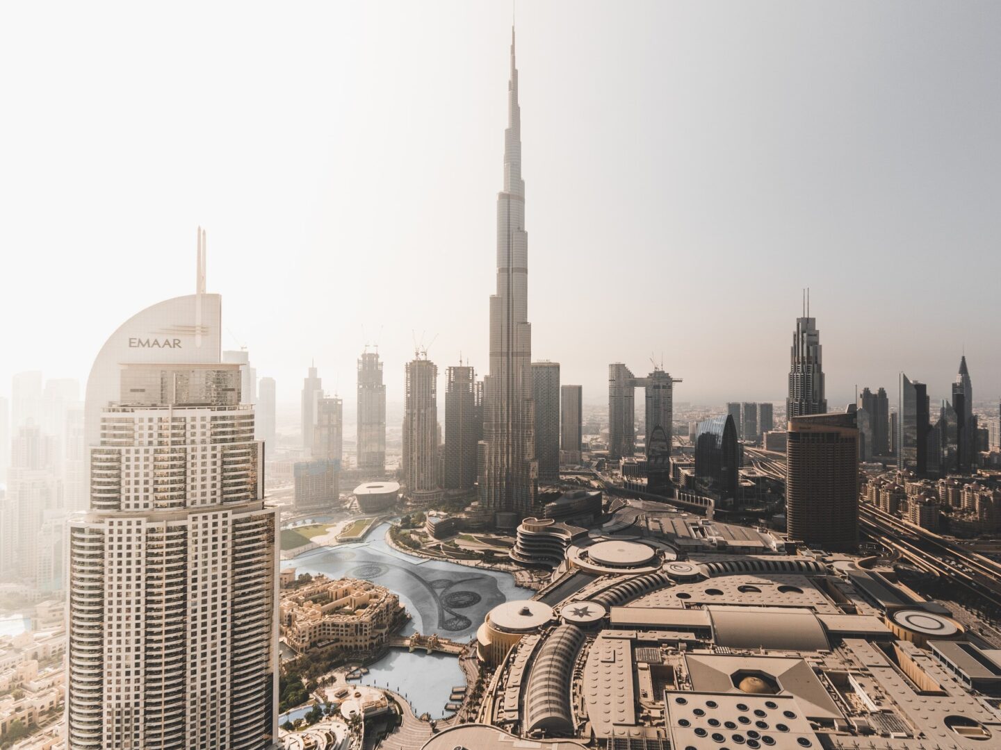 A group of professionals engaged in a business discussion in a modern office setting, representing the process of company registration in Dubai.