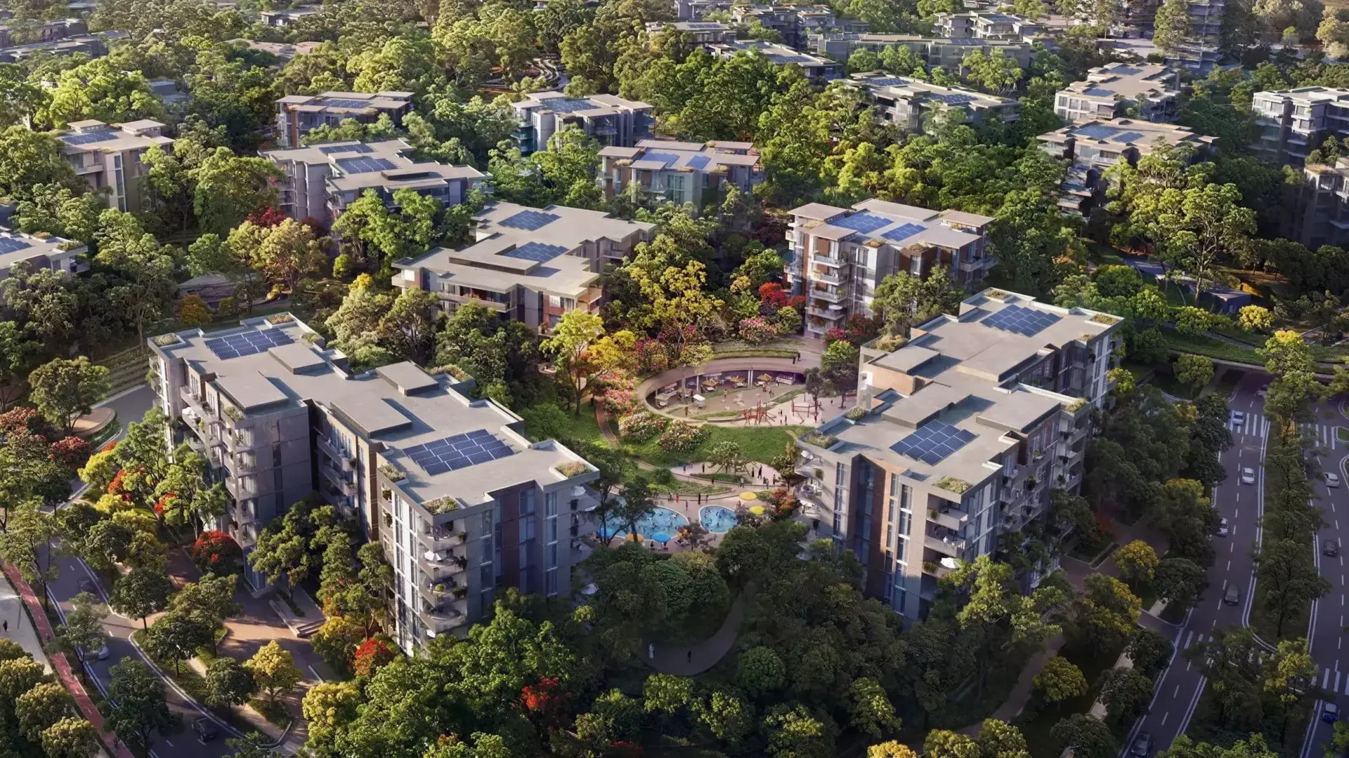 A residential development in Ghaf Woods, featuring a lush green landscape with modern villas and roads.