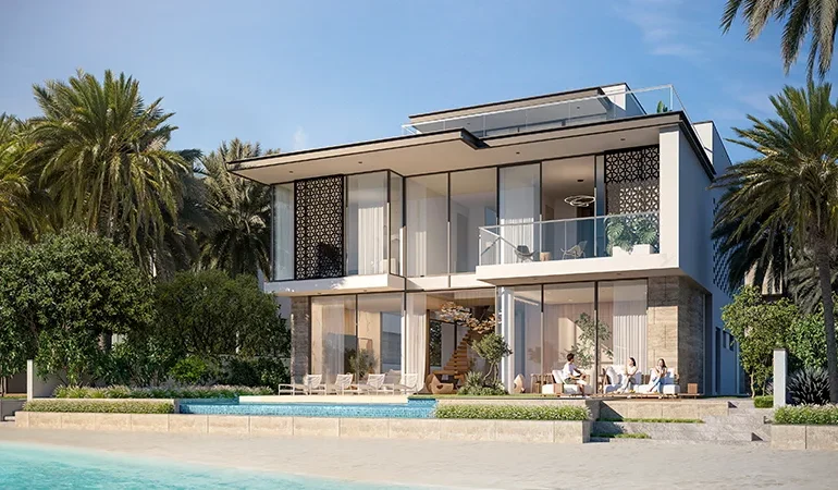 A photo from the side of a cream-colored villa