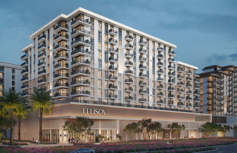 A photo of a white apartment with a palm tree next to it, and on its entrance, apartment written by Ellison