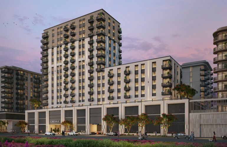 A sleek mid-rise residential tower featuring a modern facade, warm evening lighting, and lush landscaping—offering a premium lifestyle at Odessa by Nshama.