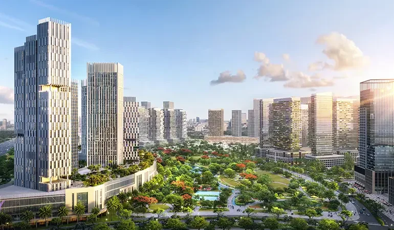 Panoramic aerial view of Azizi Milan Tower Dubai surrounded by lush landscaping and modern towers in Dubai.