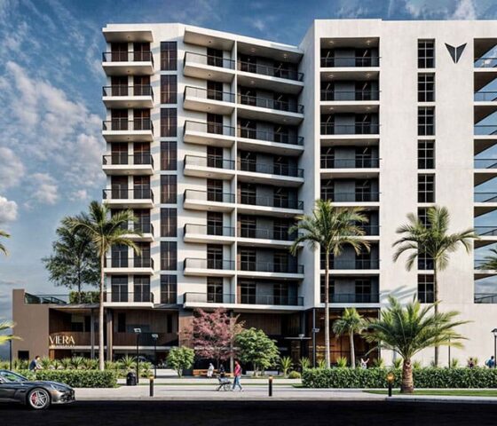 Stylish multi-storey façade with private balconies and lush landscaping at Viera Residences in Dubai.