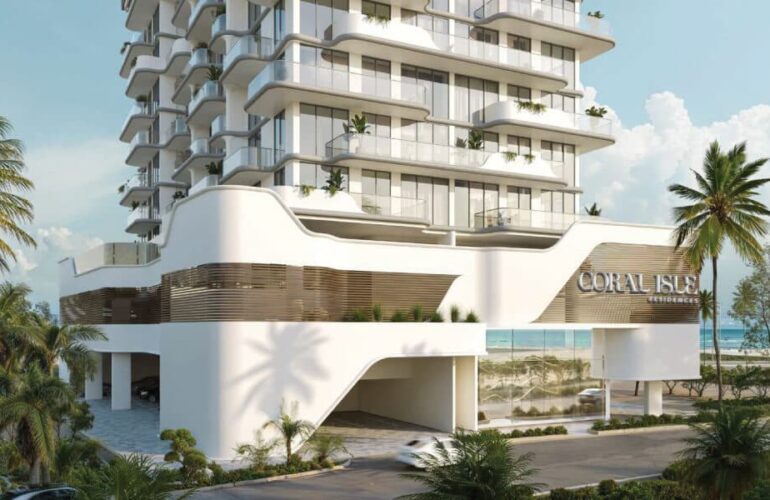 Contemporary architectural design of Coral Isle Residences Dubai featuring flowing white lines and sculpted balconies.