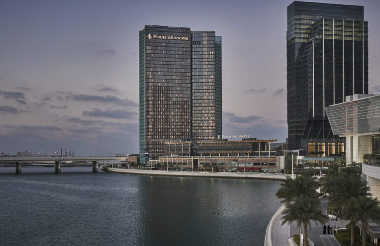 Stunning view of the Dubai skyline from Four Seasons Private Residences, overlooking the serene waterfront.