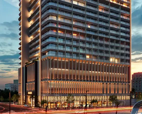 Night view of Azizi Arian residential tower in Dubai with illuminated facade