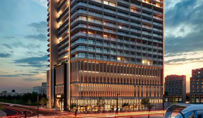 Night view of Azizi Arian residential tower in Dubai with illuminated facade