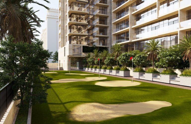 Mini putting green surrounded by luxury residences and landscaped palm trees at Solaia Residences Dubai.