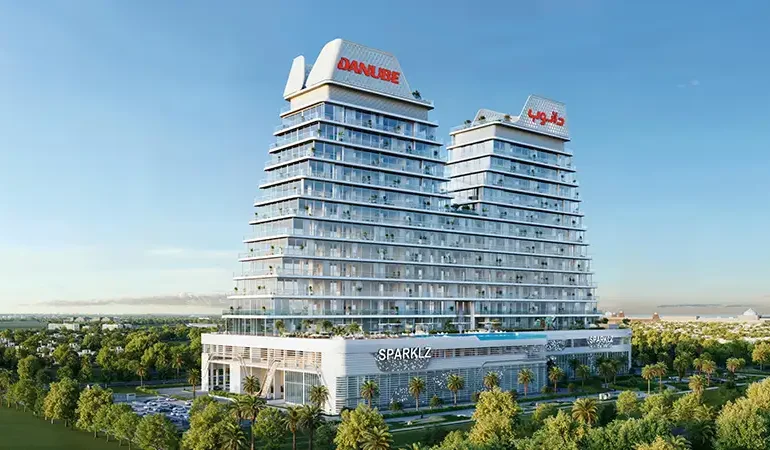 Iconic curved towers of Sparklz by Danube Dubai with sleek glass façade and signature branding.