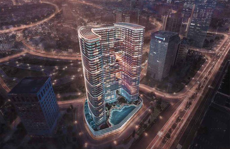 Aerial nightshot of Binghatti Hills complex with illuminated building contours