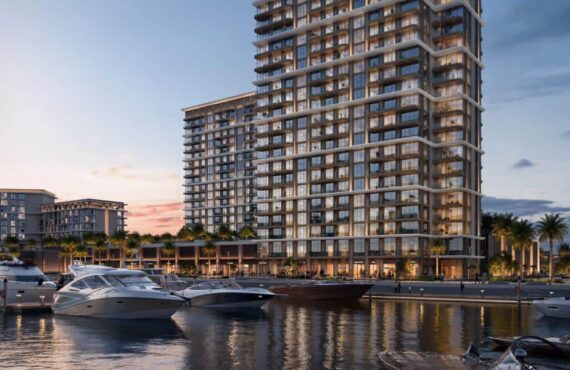 View of the Baystar by Vida residential tower in Dubai located along the marina waterfront with yachts docked nearby.