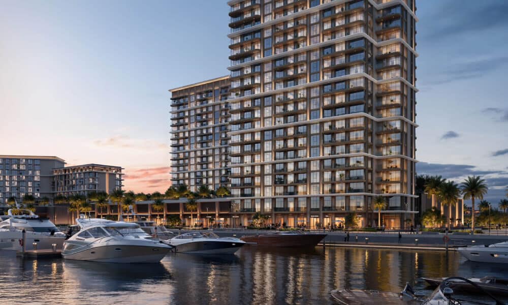 View of the Baystar by Vida residential tower in Dubai located along the marina waterfront with yachts docked nearby.