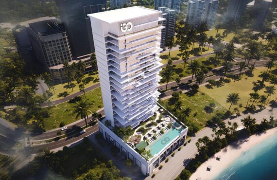 view of Ayaan Heights residential tower with illuminated façade and poolside