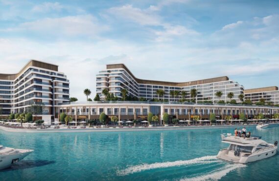 Exterior waterfront view of Bayfront Marina Residences in Dubai, showing luxury modern buildings beside turquoise waters. sobha