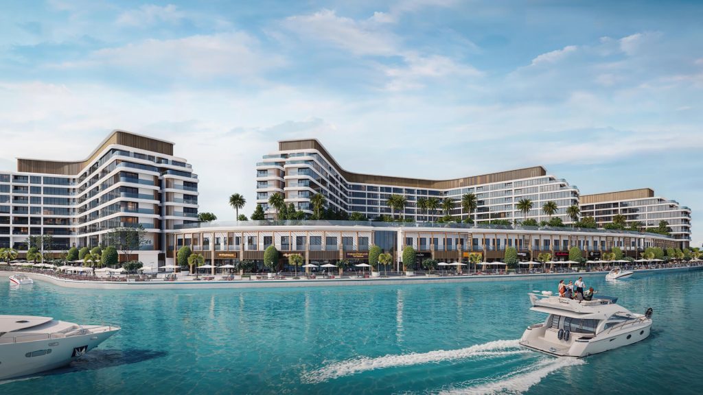 Exterior waterfront view of Bayfront Marina Residences in Dubai, showing luxury modern buildings beside turquoise waters. sobha