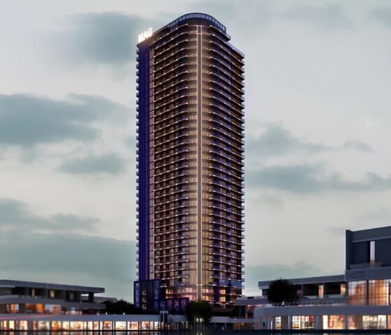Night view of MBL Signature residential tower in Dubai with modern architectural design