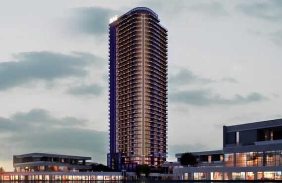 Night view of MBL Signature residential tower in Dubai with modern architectural design
