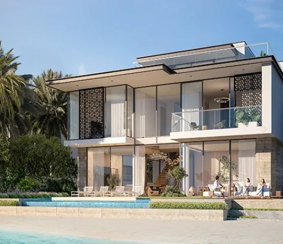 A photo from the side of a cream-colored villa