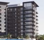 A photo of an apartment facing a swimming pool