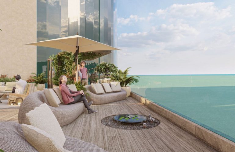 Photo of several sofas arranged facing an infinity pool with a wicker base