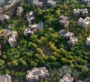 Explore Capria at Ghafwoods by Majid Al Futtaim from above, a community immersed in greenery, offering a unique blend of nature and urban living.