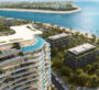 Drone shot of the Beach Walk Grand complex surrounded by beach and greenery in Dubai