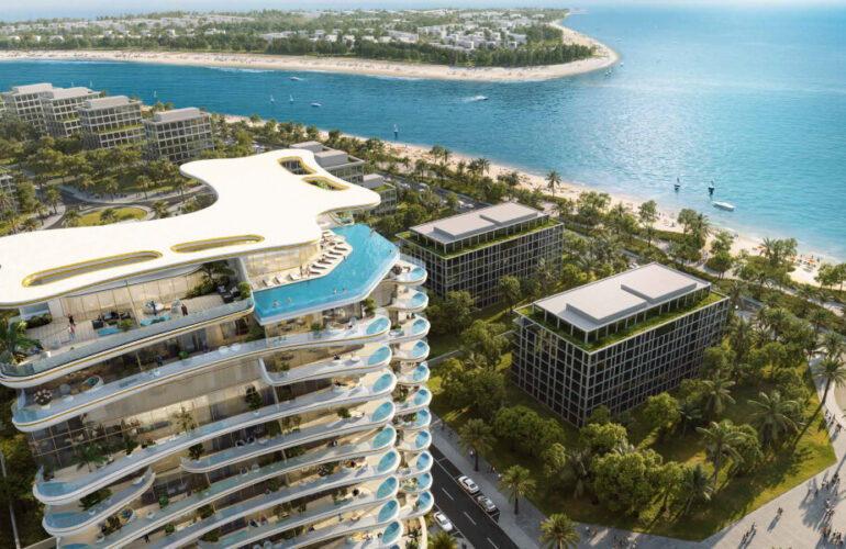Drone shot of the Beach Walk Grand complex surrounded by beach and greenery in Dubai