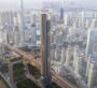 Drone shot of DWTN Residences skyscraper among Dubai skyline