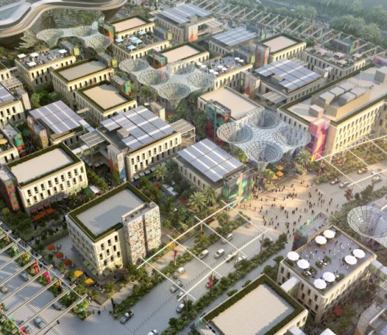 A photo of the top view of the Al Waha Residences town, where there are many houses and townhouses that are stacked together.