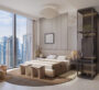 Elegant master bedroom with large windows overlooking Dubai skyline