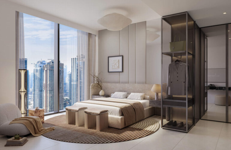 Elegant master bedroom with large windows overlooking Dubai skyline