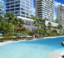 Resort-style swimming pool surrounded by palm trees and modern residential towers at Ayaan Heights.