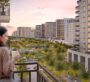 Scenic balcony overlooking the gardens and buildings of Camden Dubai