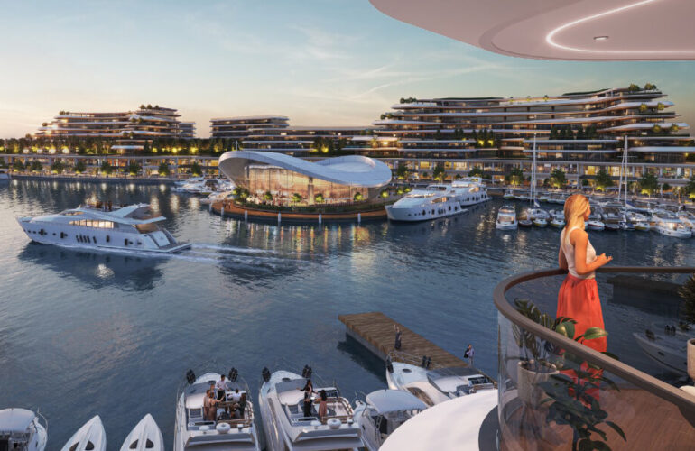 Balcony view of the marina at Bayfront Marina Residences in Dubai during sunset, overlooking boats and the promenade.