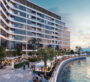 Community area near the pool at Bayfront Marina Residences, Dubai, surrounded by palm trees and modern buildings.