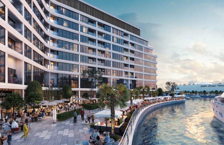 Community area near the pool at Bayfront Marina Residences, Dubai, surrounded by palm trees and modern buildings.