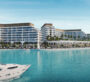 Exterior waterfront view of Bayfront Marina Residences in Dubai, showing luxury modern buildings beside turquoise waters.