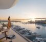 Scenic sunset view from the balcony at Baystar by Vida, Dubai, overlooking a peaceful marina filled with boats.
