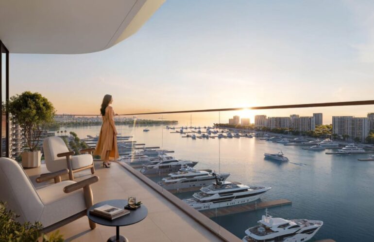 Scenic sunset view from the balcony at Baystar by Vida, Dubai, overlooking a peaceful marina filled with boats.