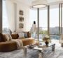 Elegant and sunlit living room in Baystar by Vida, Dubai, offering panoramic views of the waterfront marina.