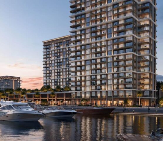 View of the Baystar by Vida residential tower in Dubai located along the marina waterfront with yachts docked nearby.