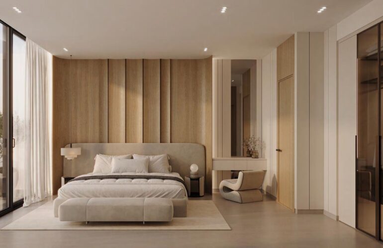 Cozy and well-lit bedroom at Binghatti Flare, Dubai, designed with soft tones and elegant furnishings.