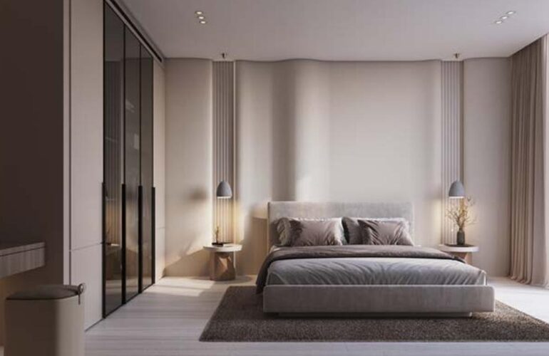Refined master bedroom in Binghatti Flare, Dubai, with large windows allowing natural light to fill the space.