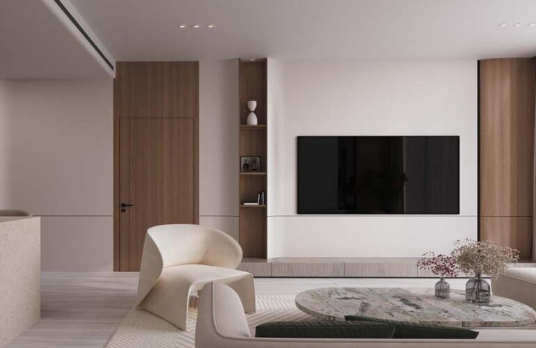 Sleek and minimalist living room design in Binghatti Flare, Dubai, featuring neutral tones and a large flat-screen TV.