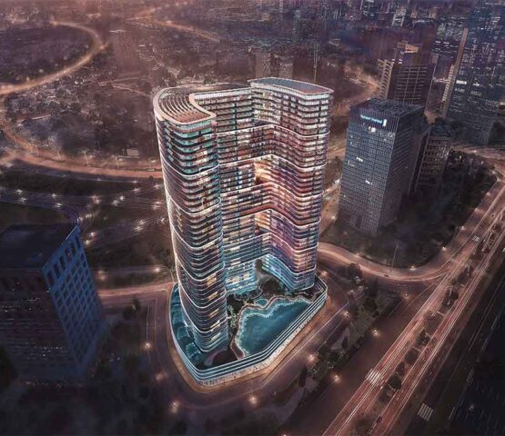 Aerial nightshot of Binghatti Hills complex with illuminated building contours