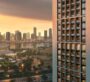 Sunset over Dubai city skyline viewed from Binghatti Twilight with high-rise buildings in the background.