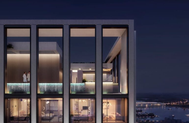 Architectural close-up of Binghatti Twilight’s modern exterior design lit up against the Dubai night sky.