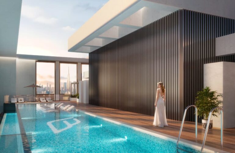 Elegant indoor pool area at Binghatti Twilight in Dubai with a woman enjoying the serene atmosphere.