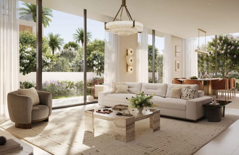 Bright and spacious living room at Selvara, with modern furnishings and floor-to-ceiling windows.